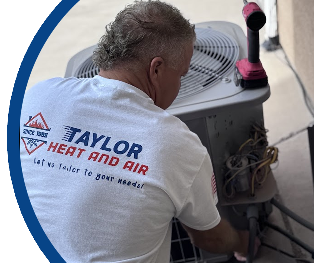 A man wearing a taylor heat and air shirt is working on an air conditioner