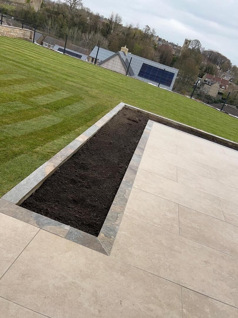 Lagom Sand porcelain paver in 1200x600 with Rustic Slate porcelain paver 900x600 cut to make a border available in County Durham