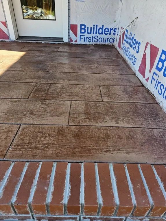 A brick walkway with a sign that says builders first source