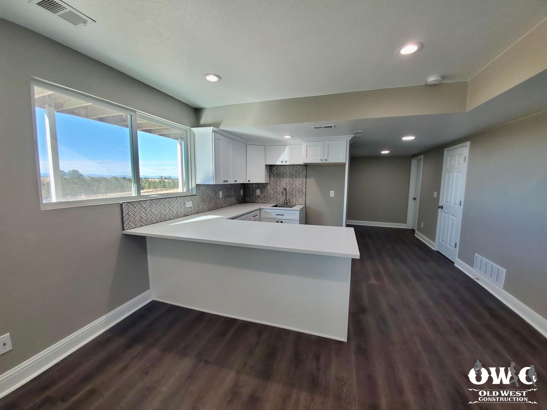 A kitchen with a large island in the middle of the room.