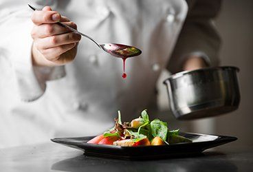 Catering — Chef Pouring Sauce in San Antonio, TX