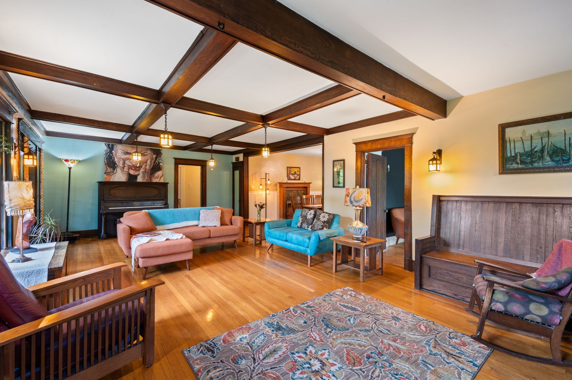 A living room filled with furniture and a rug.