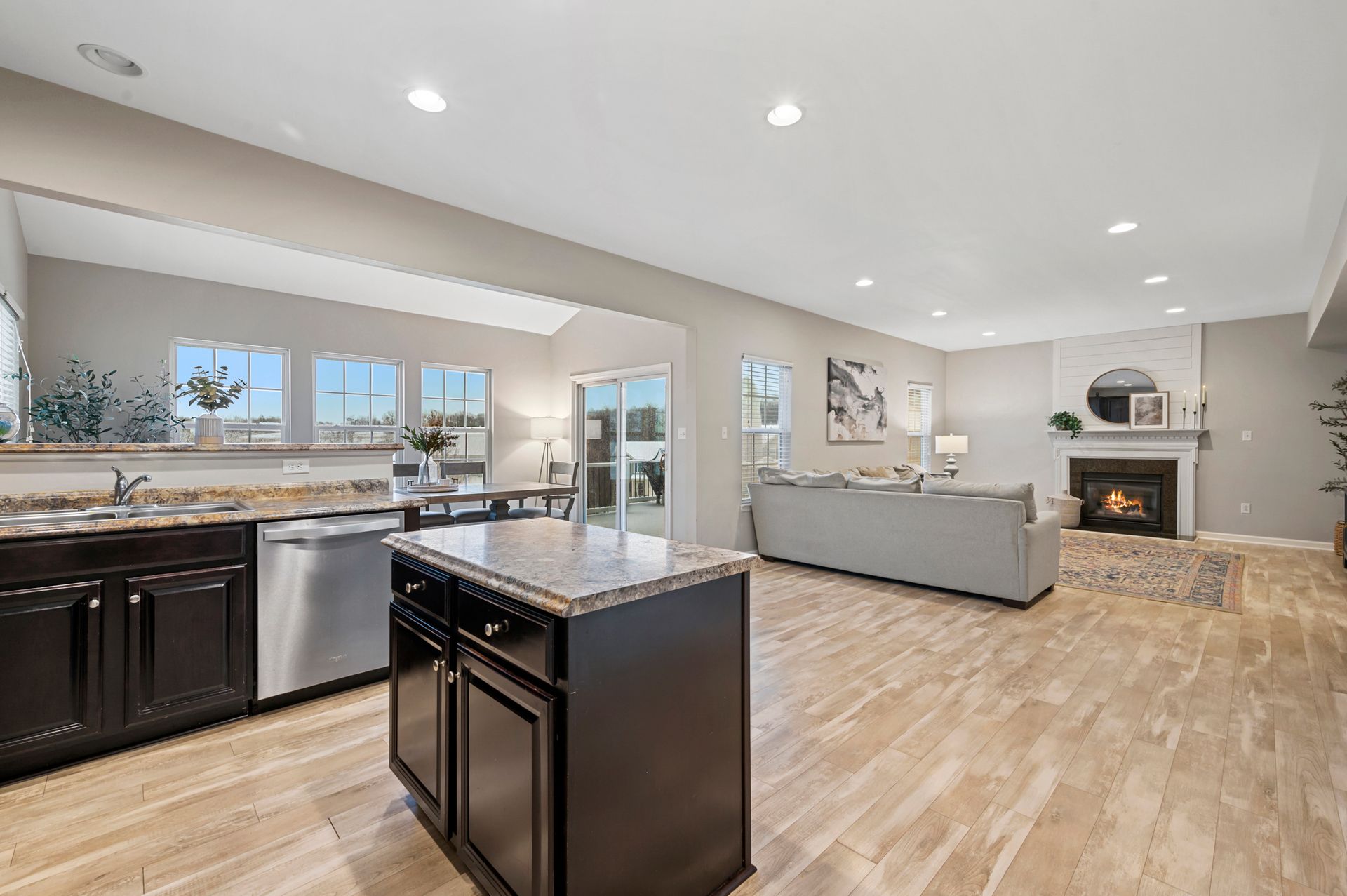 The kitchen is open to the living room and has a large island in the middle.