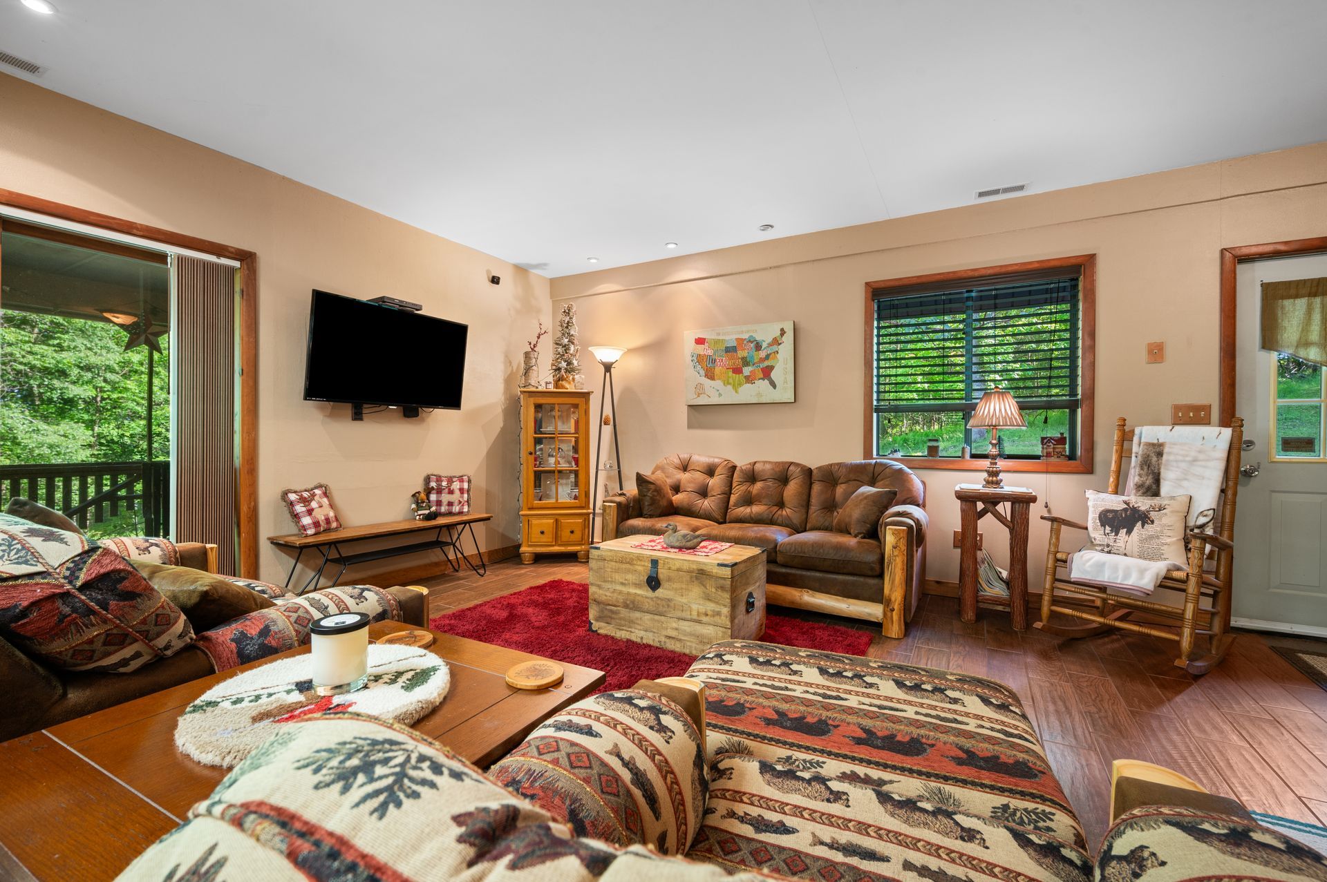 A living room filled with furniture and a flat screen tv.
