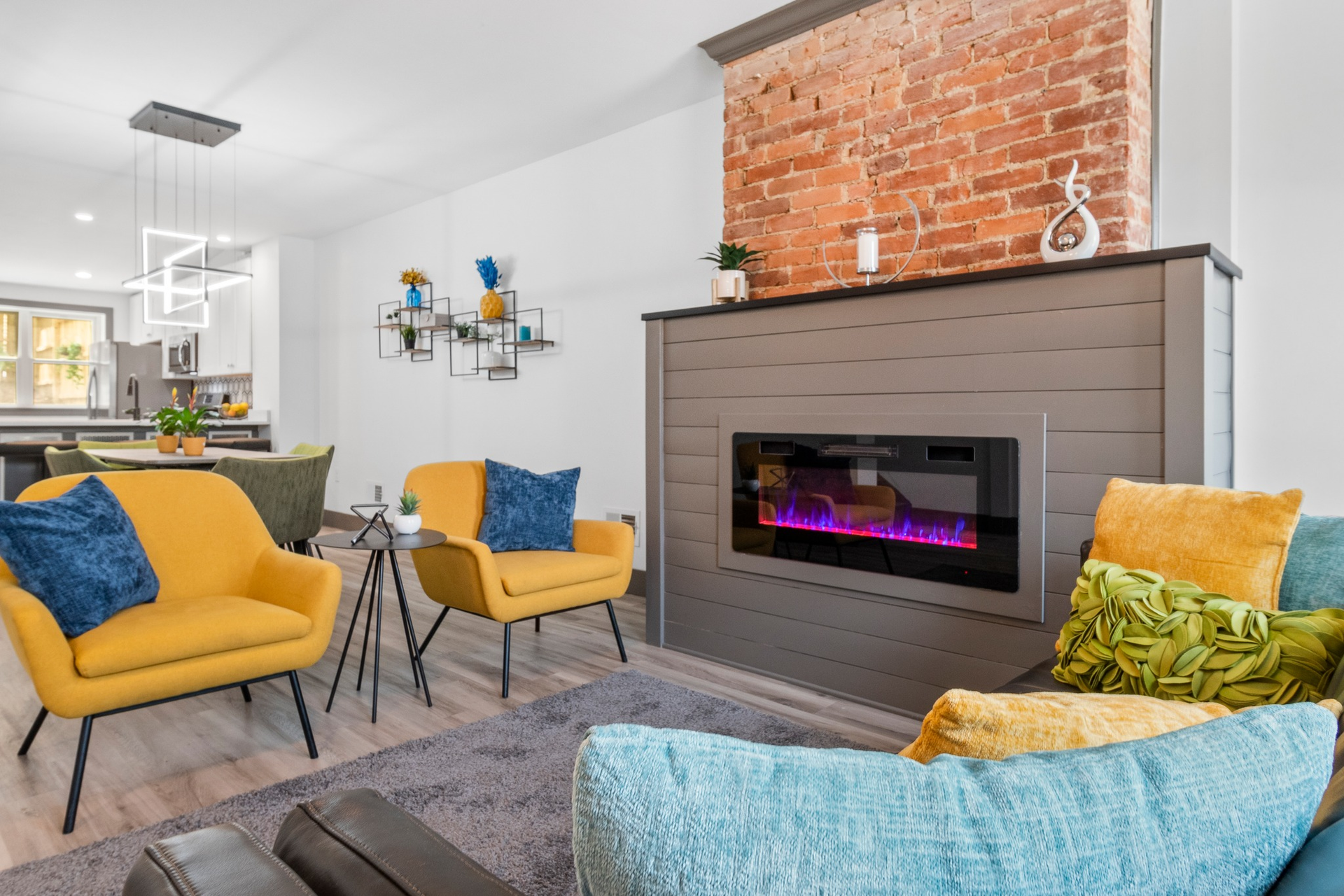 A living room filled with furniture and a fireplace.