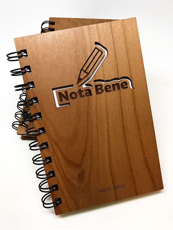 a wooden notebook with the word nota bene on it