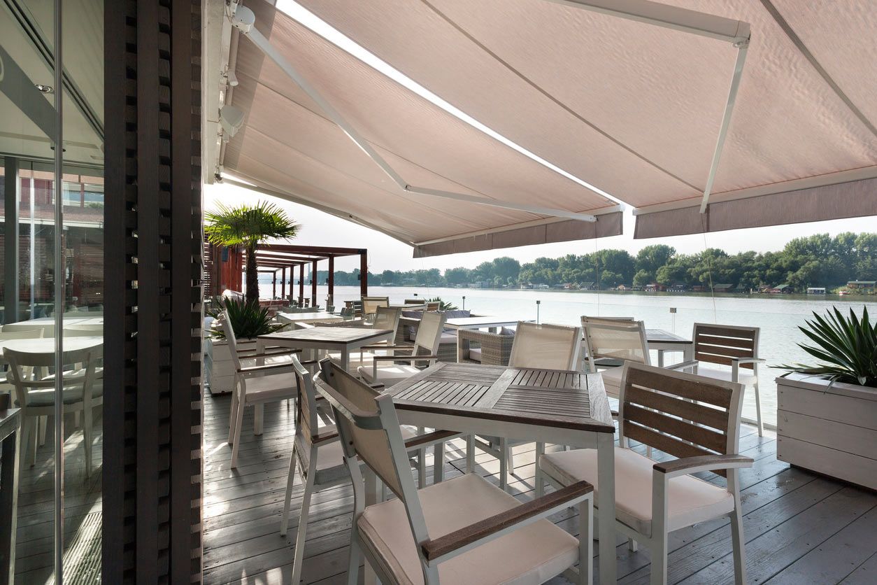awning over waterfront dining area