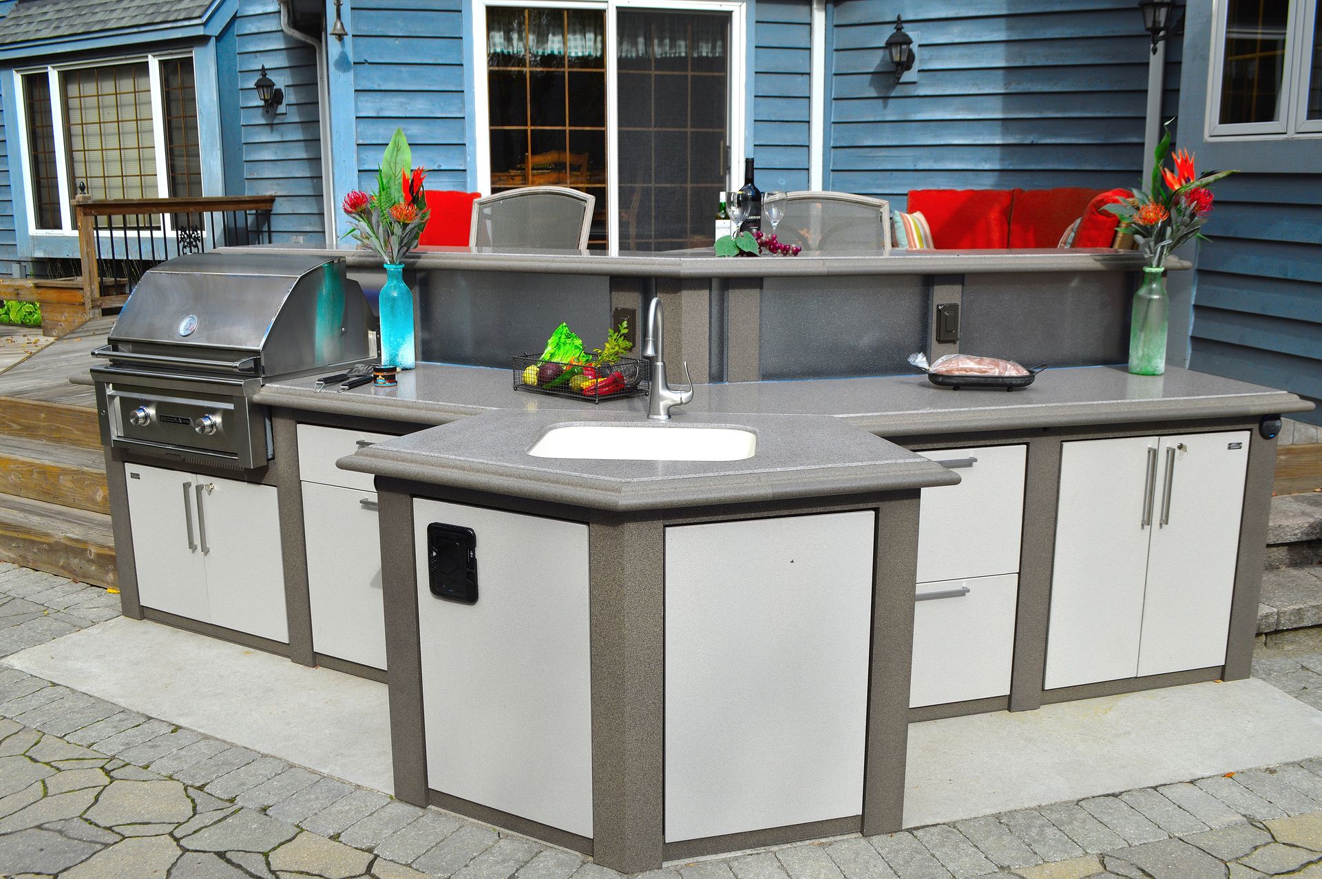 outdoor cooking area with grill, countertops, and sink, installed by ener-g tech, inc.