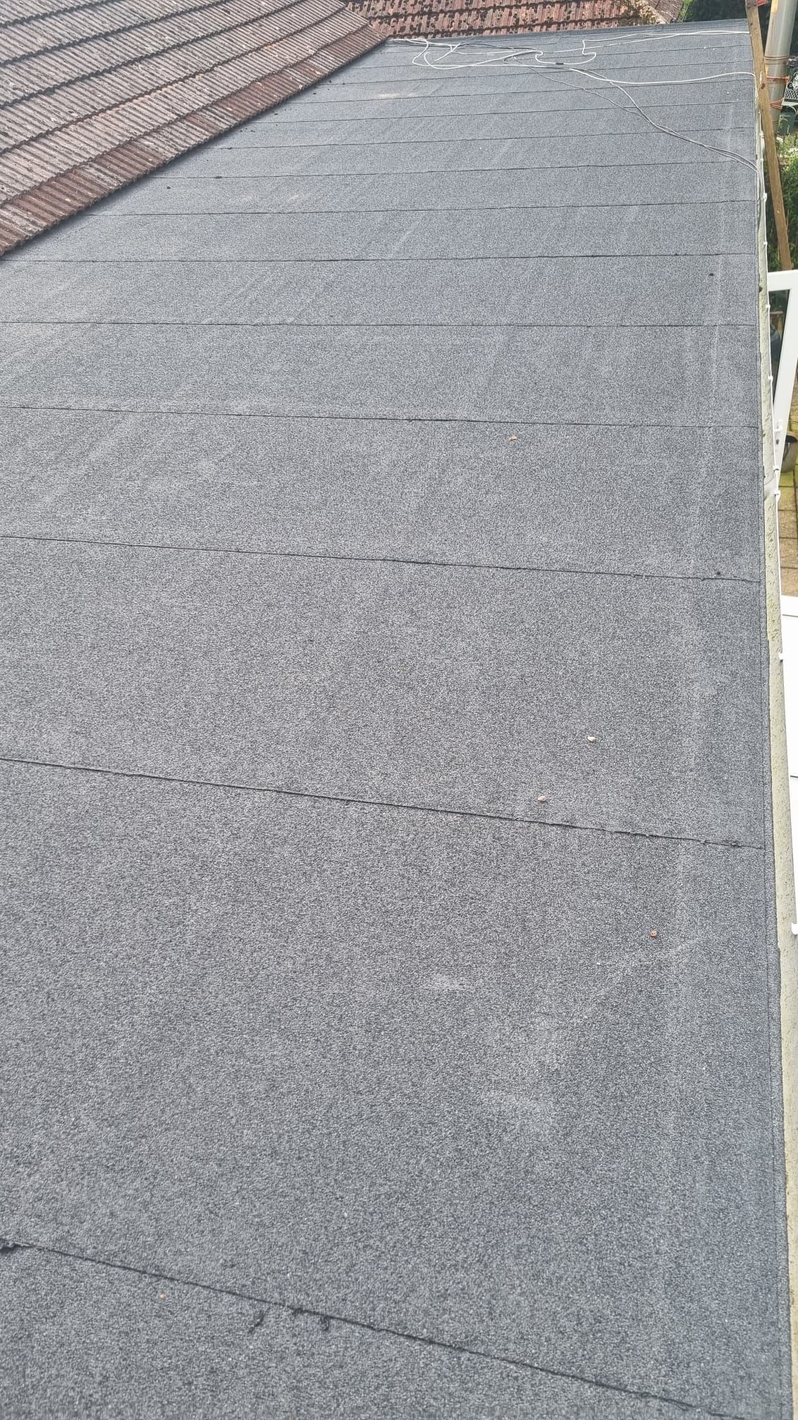 A close up of a roof with shingles on it.