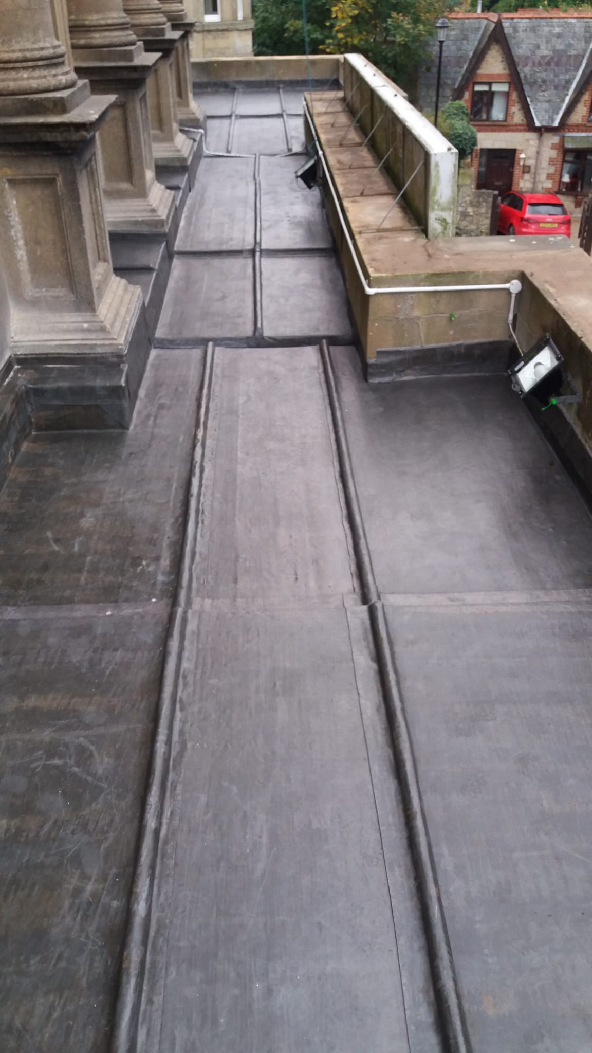 The roof of a building with a ramp leading to it.