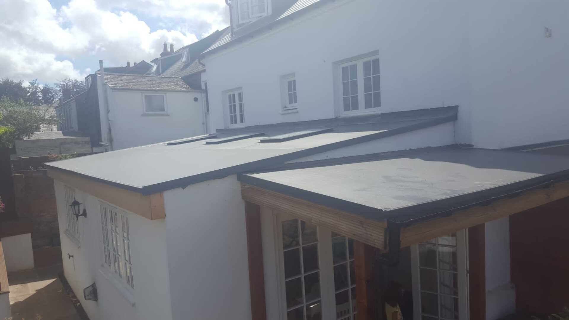 An aerial view of a house with a flat roof.