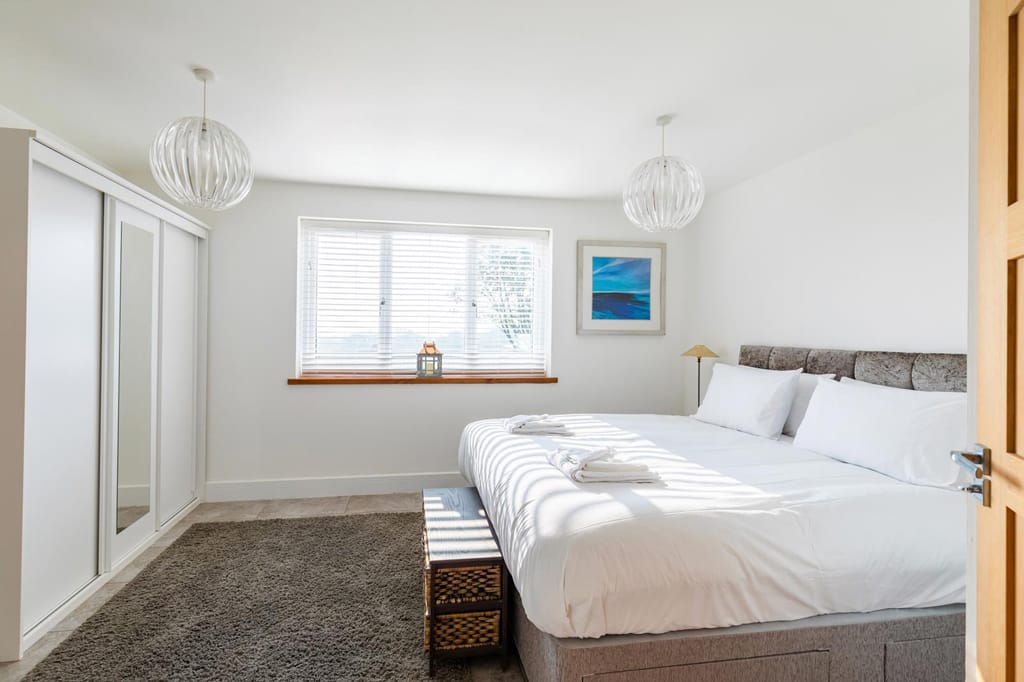 There is a large bed in the middle of the room.