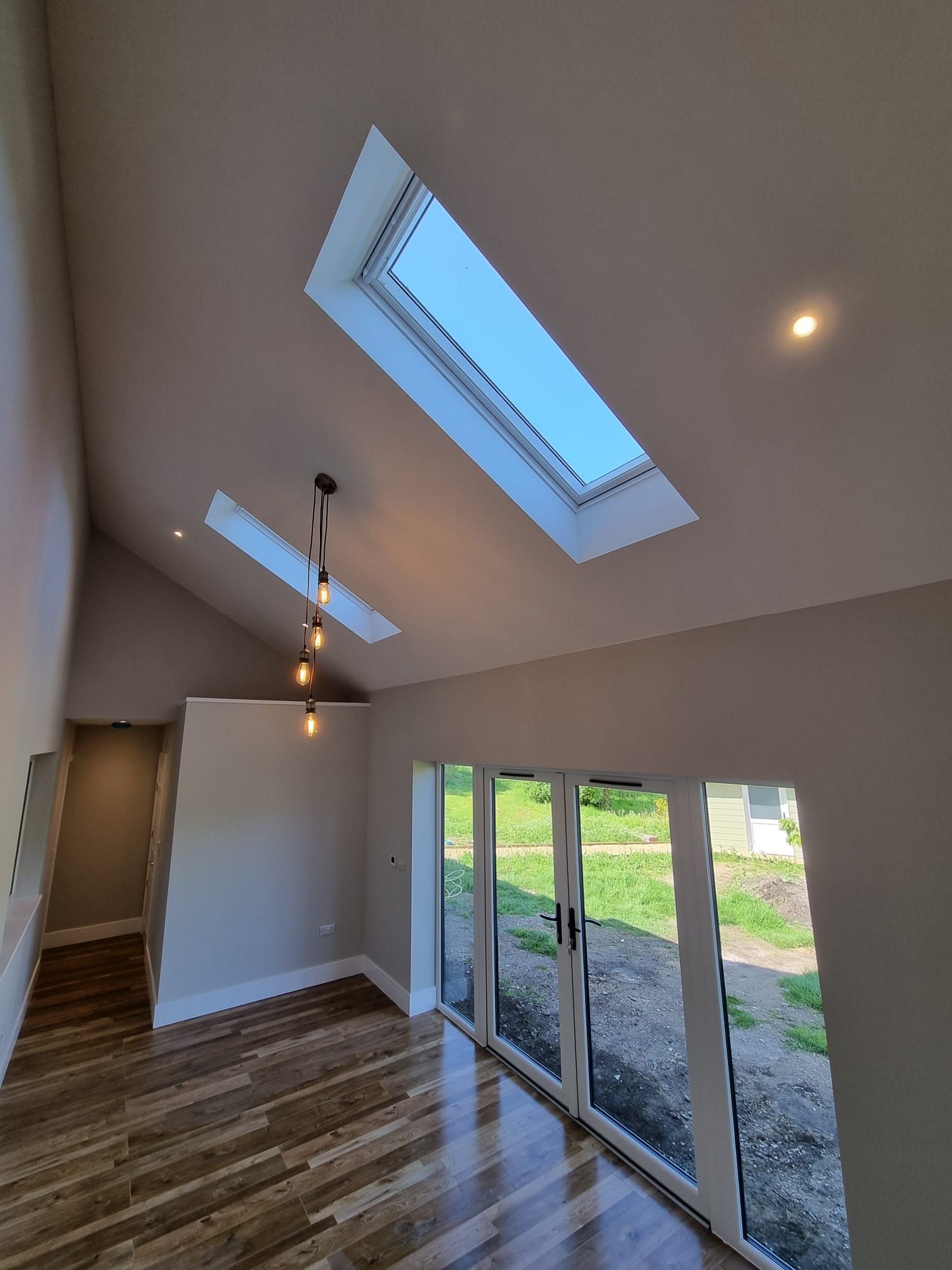 There is a skylight in the ceiling of the room.