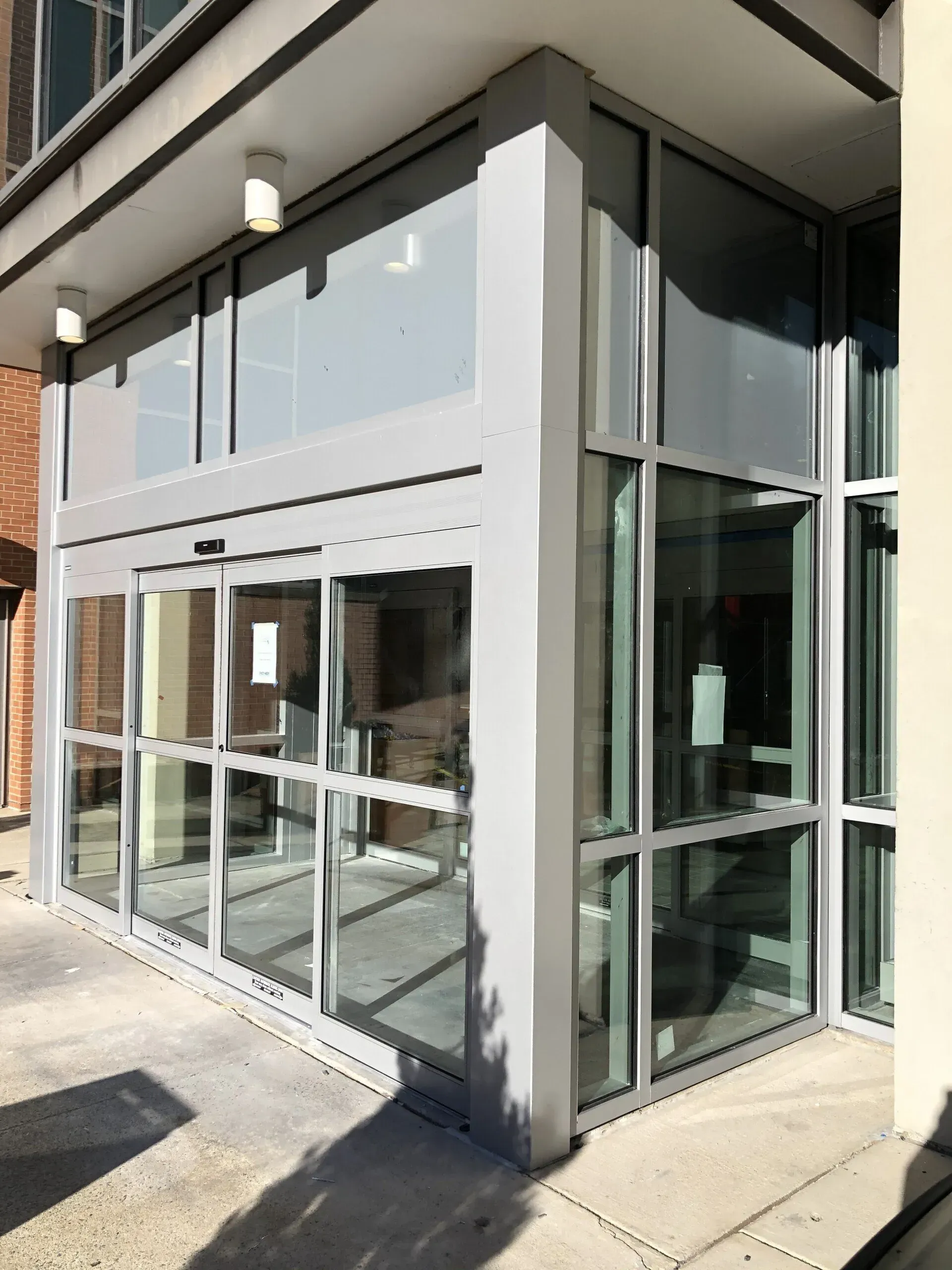 A building with a lot of windows and a sliding glass door