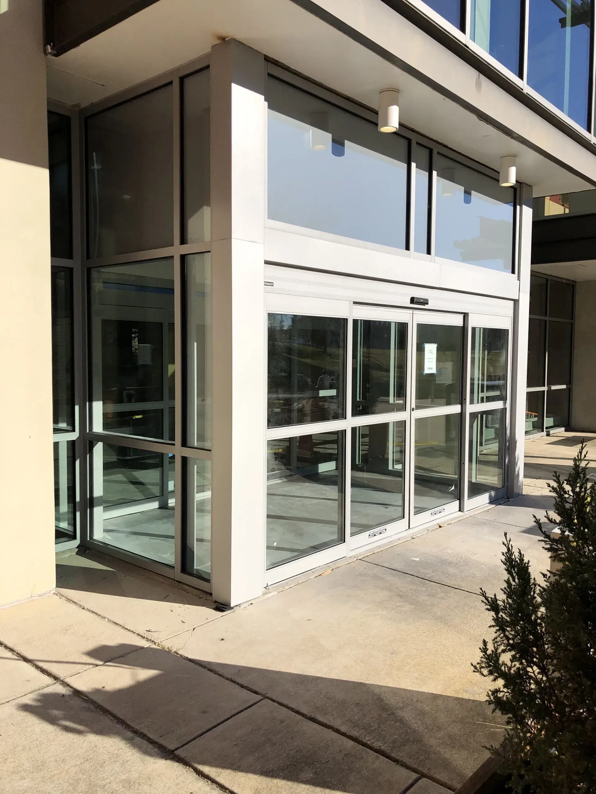 A building with a lot of windows and a sliding glass door