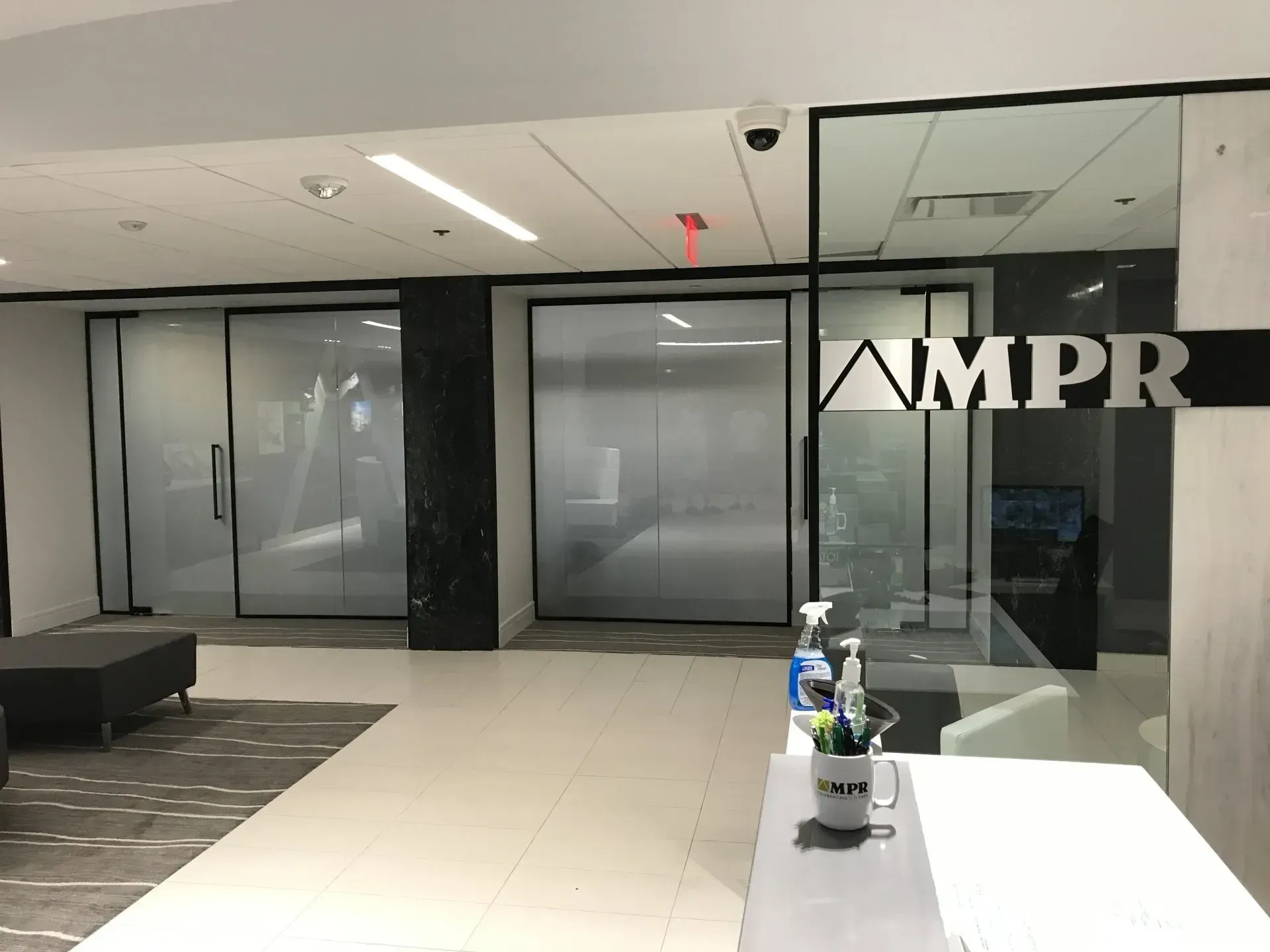 A lobby with a sign that says ampr on it