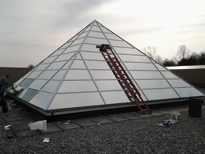 A pyramid with a ladder on top of it