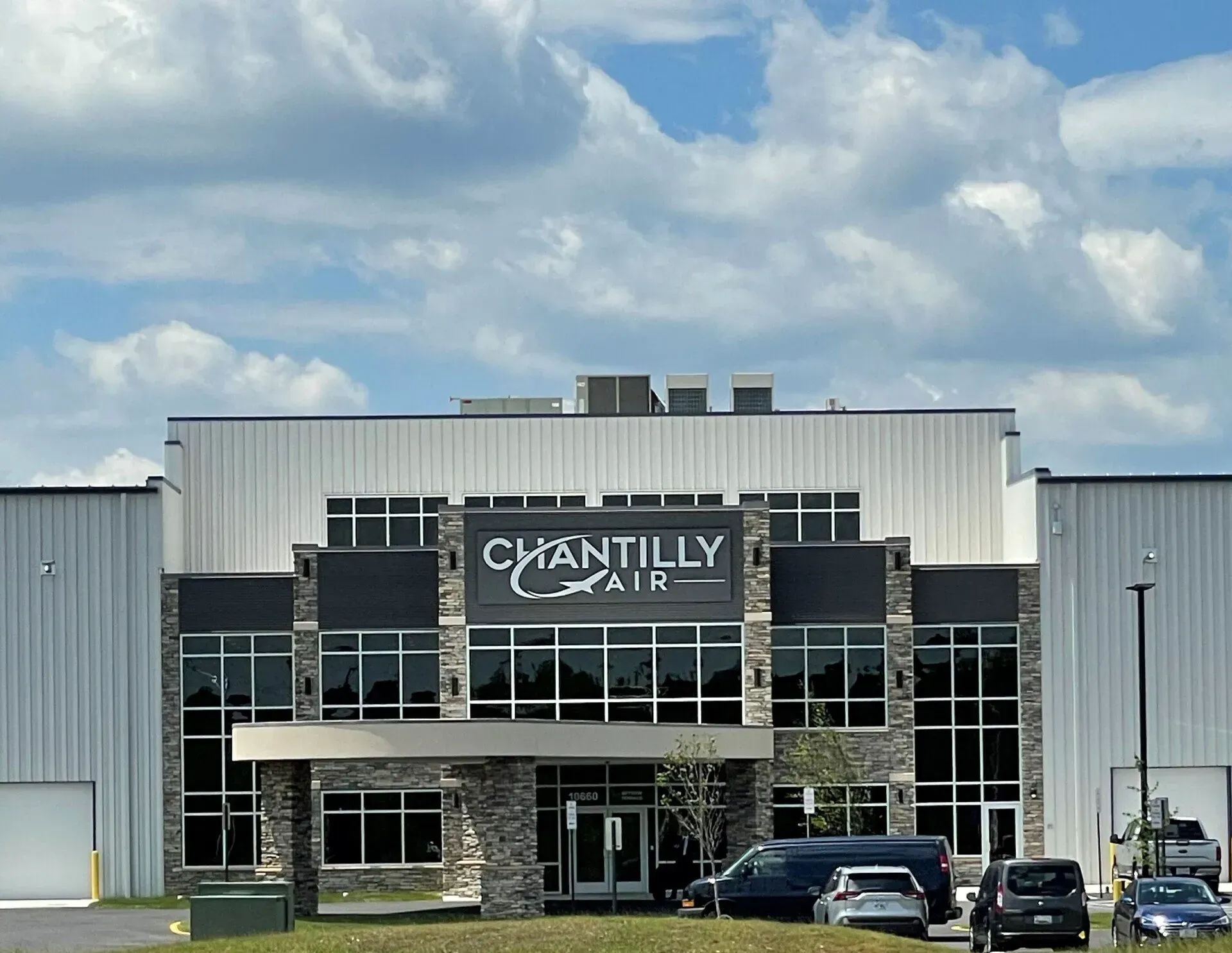 A large building with a sign that says chantilly air