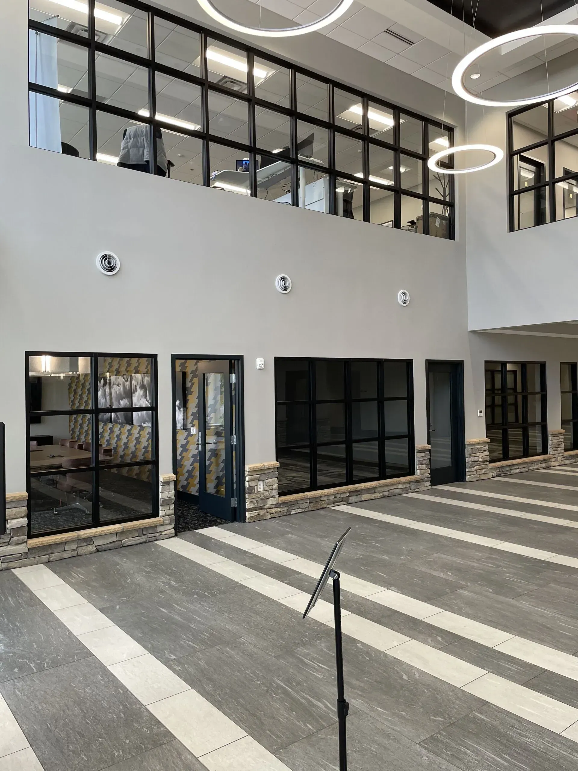 A large building with a lot of windows and a microphone in the middle