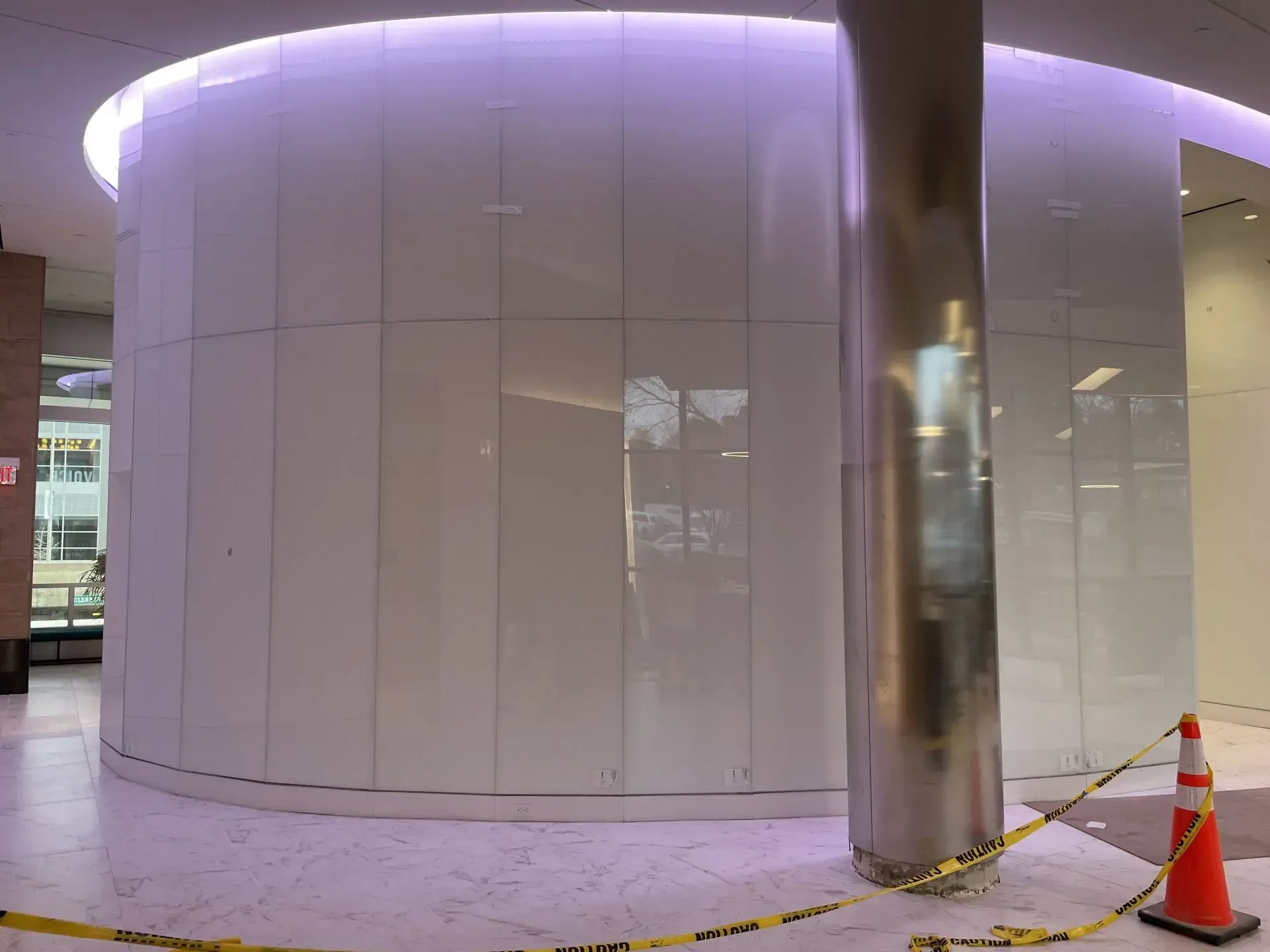A building under construction with a purple light on the ceiling