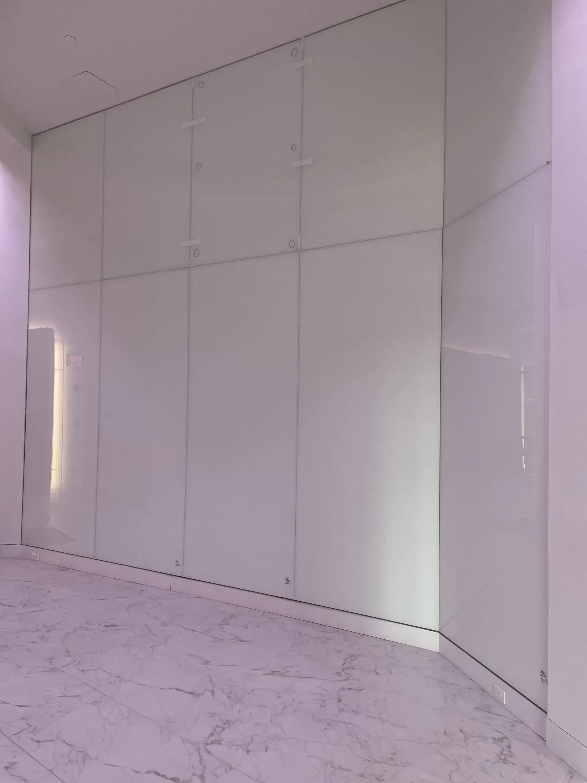 A room with white walls and a marble floor