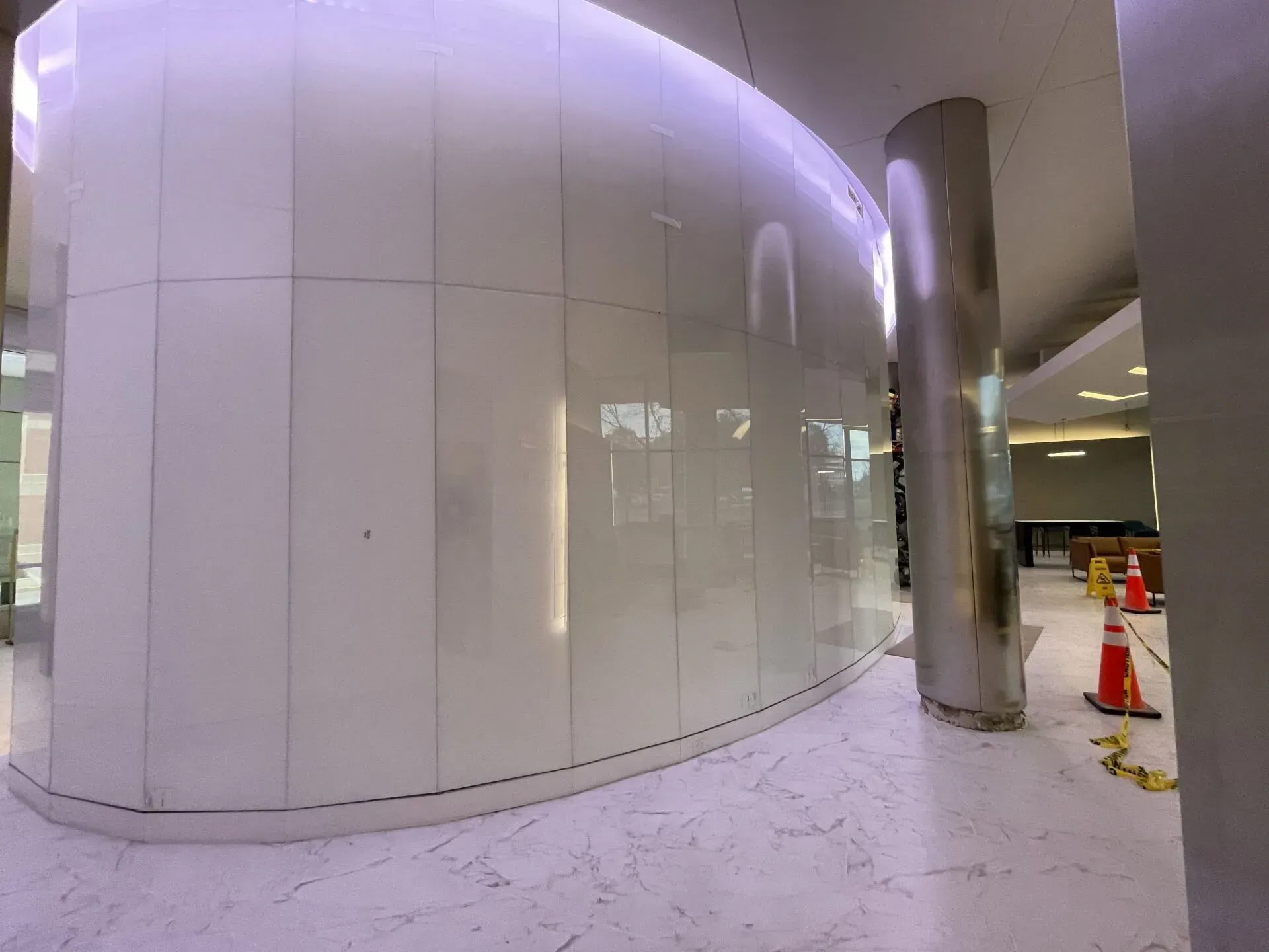 A building with a purple light on the wall