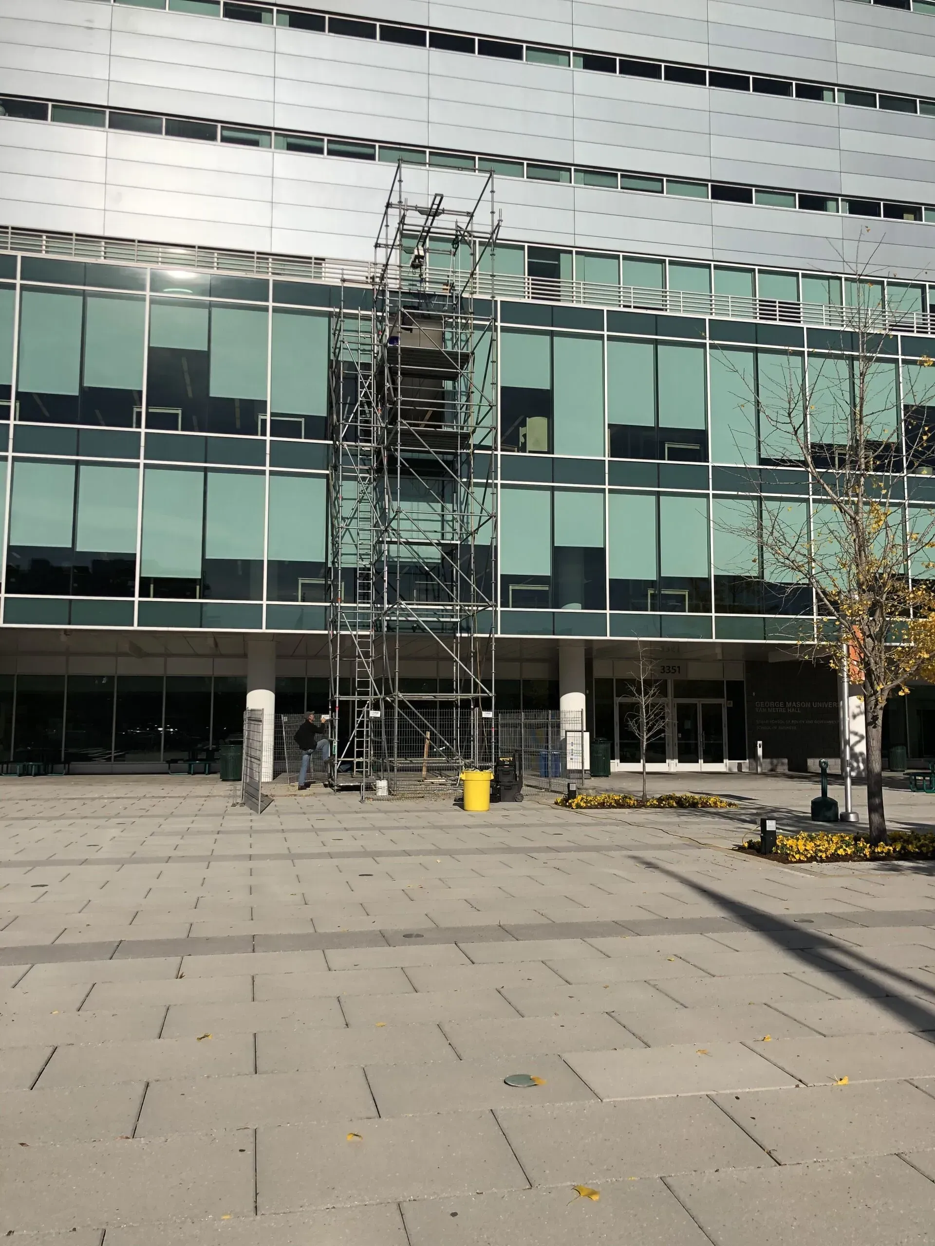 A large building with a lot of windows and scaffolding in front of it