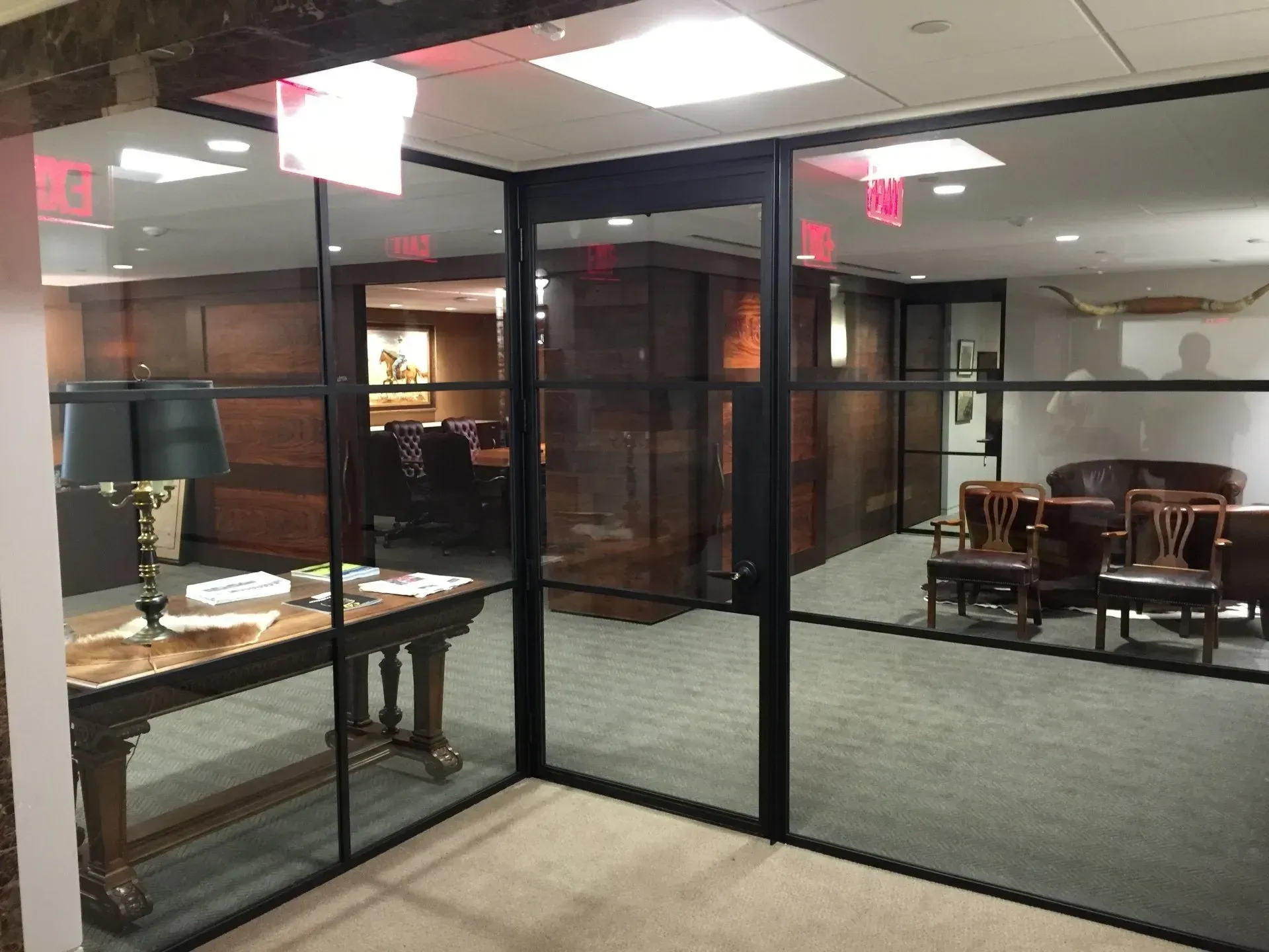 A room with a table and chairs in it