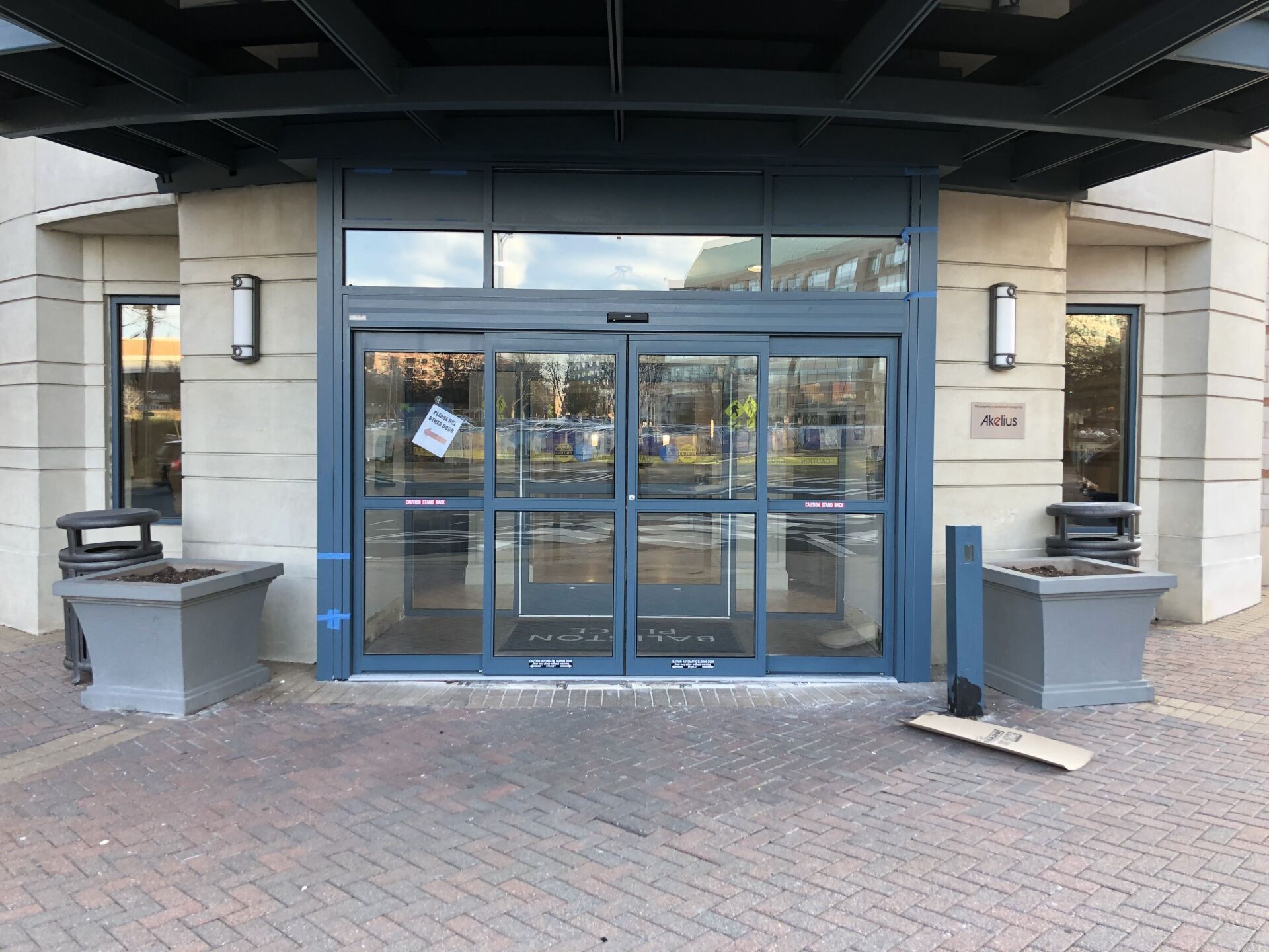 The front of a building with a sliding glass door.