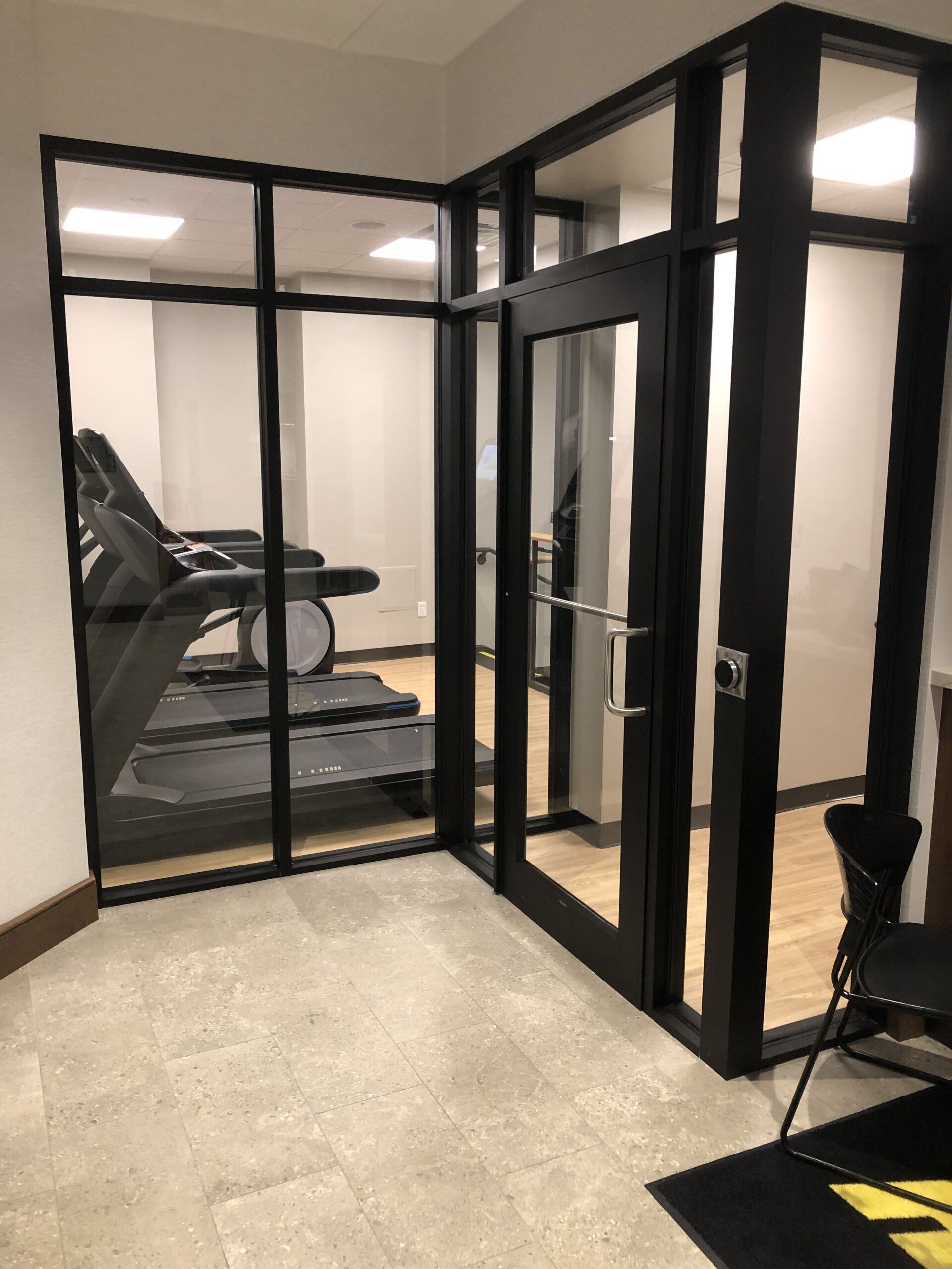 There is a treadmill in the middle of the room.