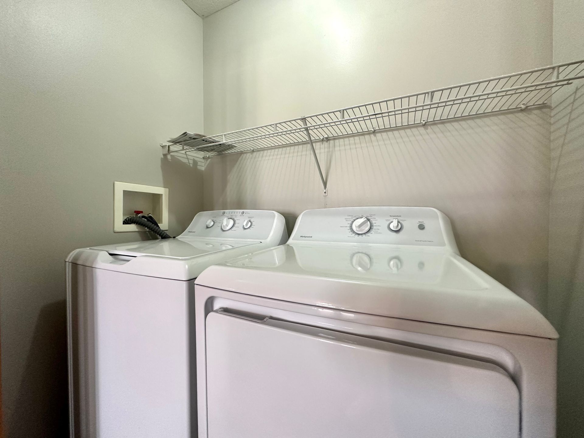 a laundry room with a washer and dryer in it .