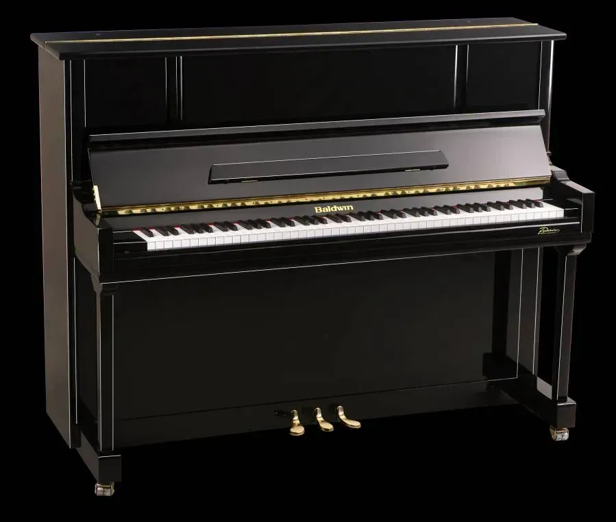 A black upright piano with a black background