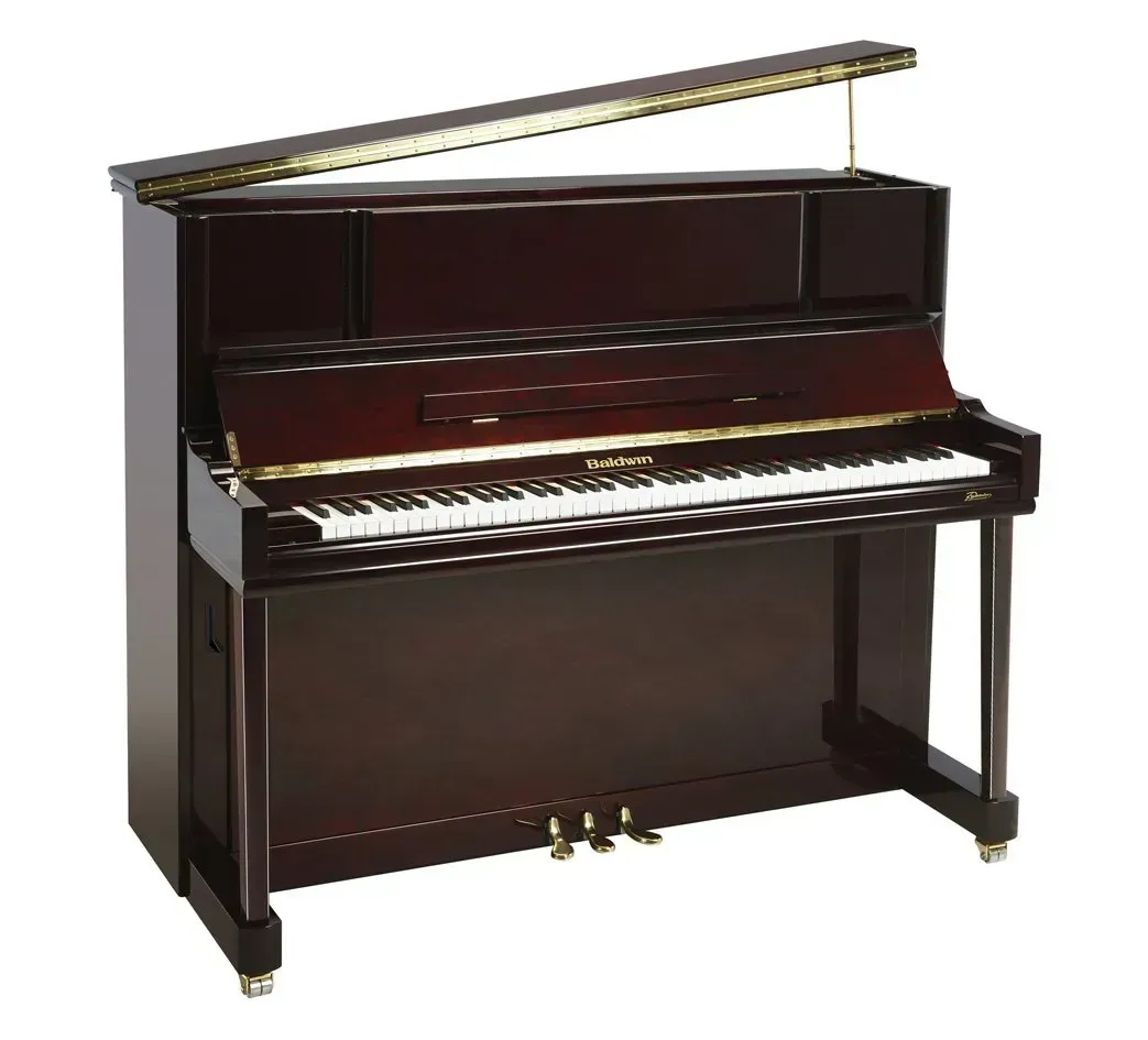 A brown upright piano with white keys on a white background