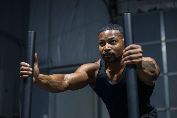 Your Trainer Trey Johnson at 360 Image Fitness in gym working on strengthening exercises in black shirt