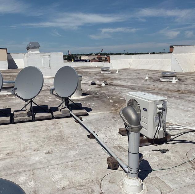 A rooftop with air conditioner