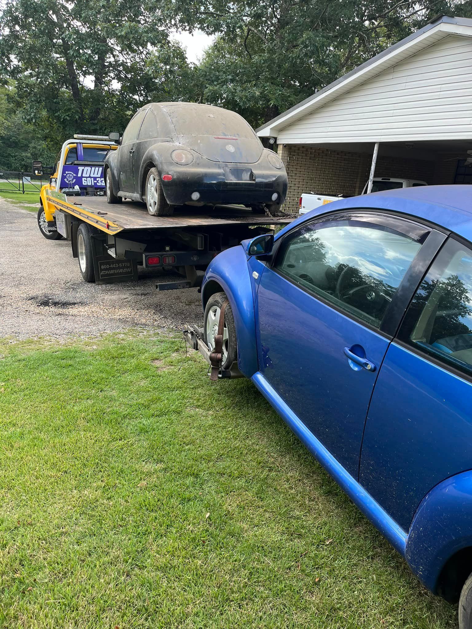 Tow truck with two cars