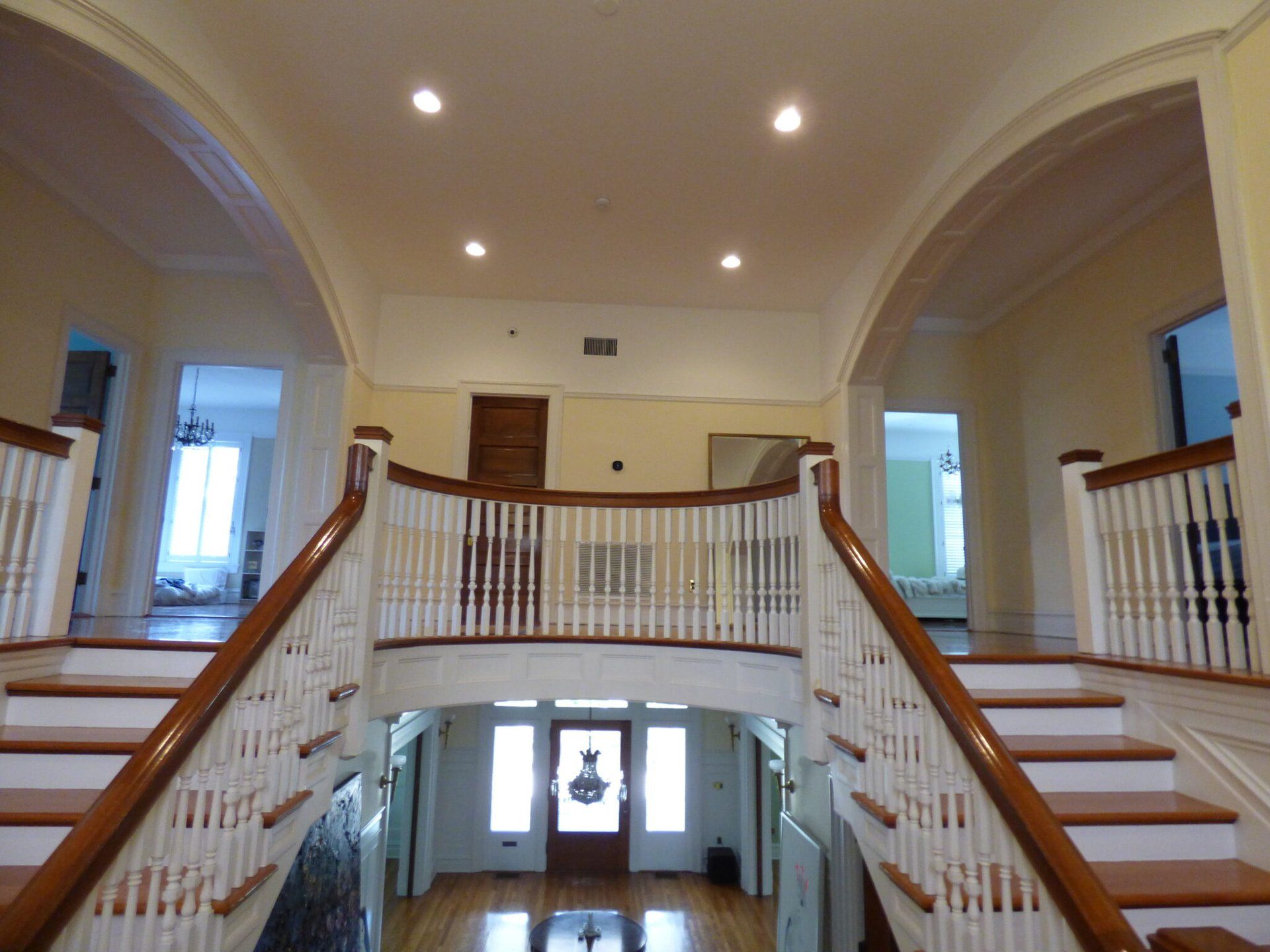 A large hallway with stairs leading up to the second floor