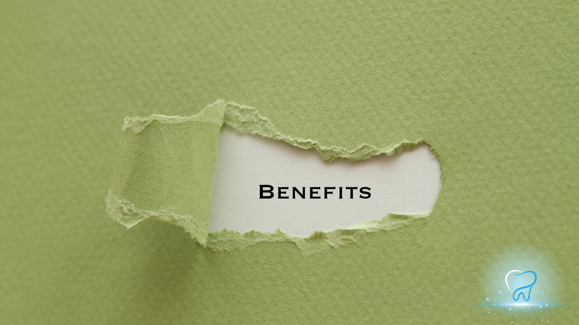 Torn green paper revealing the word