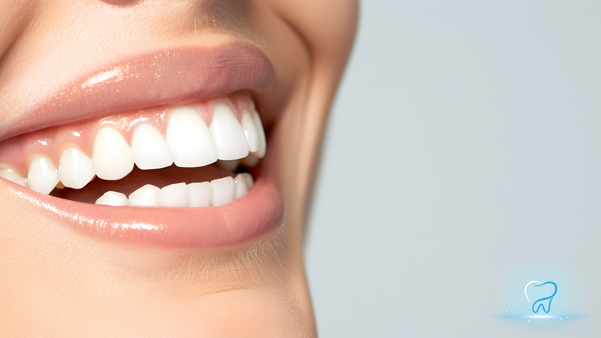 Close-up of a person smiling, showing bright white teeth and healthy gums.