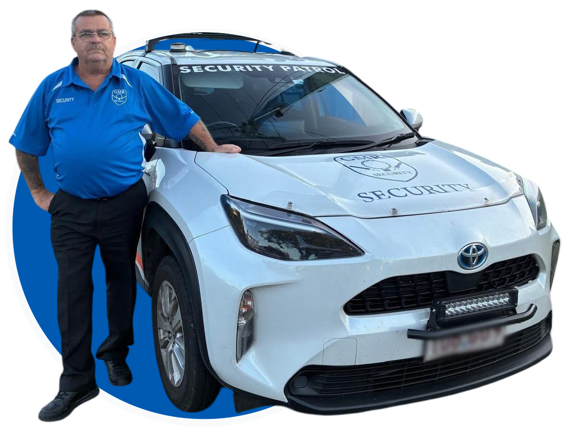 Man in blue uniform beside white security car.