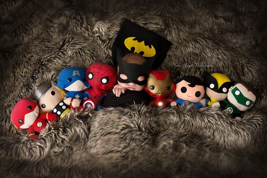 Newborn baby with toy superheroes — Pearland, TX — Sara Hunt Photography Newborn baby with toy superheroes — Pearland, TX — Sara Hunt Photography