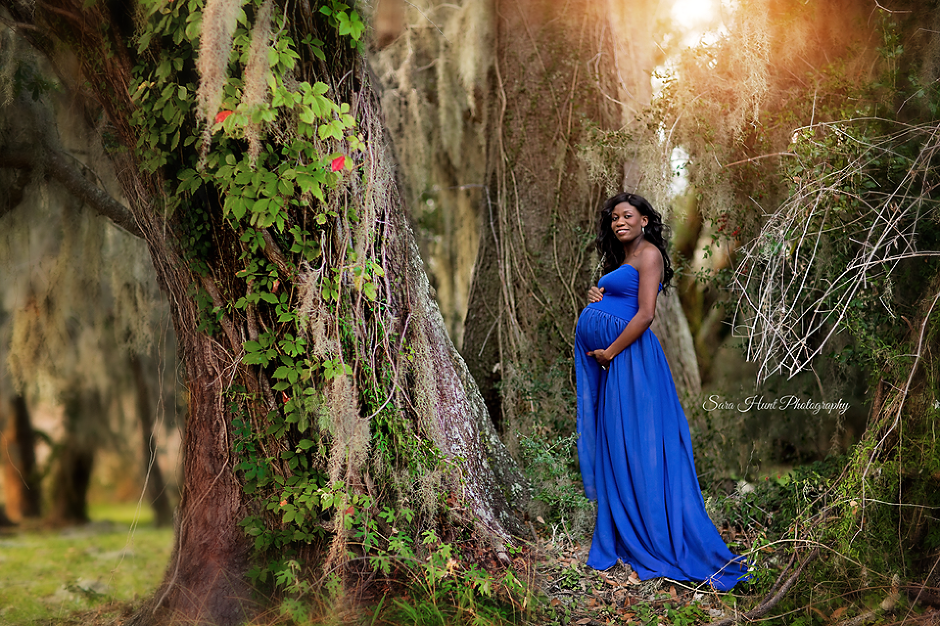 Pregnant woman in blue dress wandering in the forest — Pearland, TX — Sara Hunt Photography