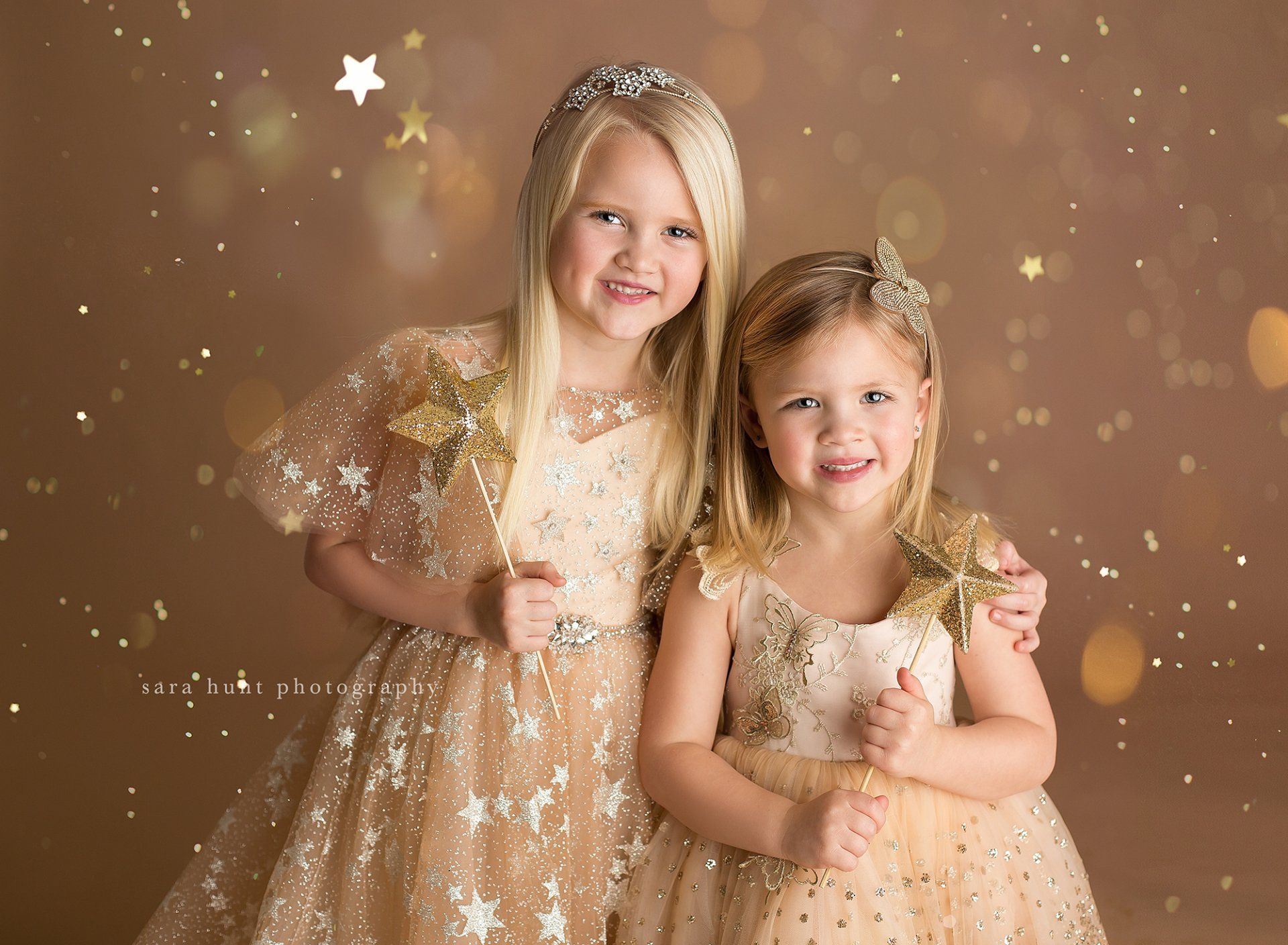 Blonde girls both holding a star wand — Pearland, TX — Sara Hunt Photography