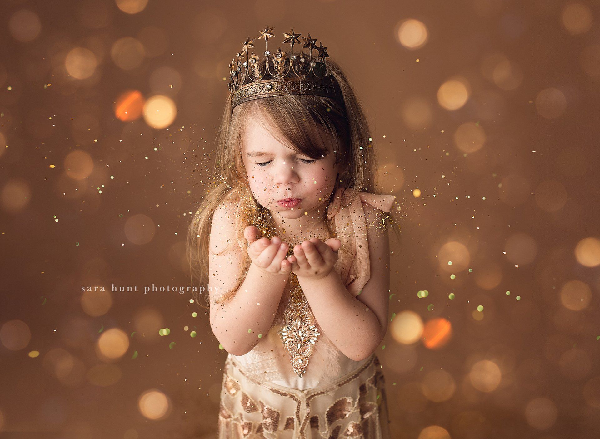 Girl in gold gown blowing the gold glitters — Pearland, TX — Sara Hunt Photography