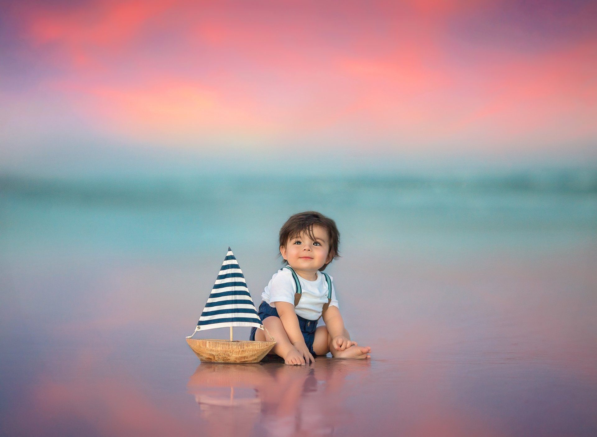 Baby boy sitting next to a boat — Pearland, TX — Sara Hunt Photography