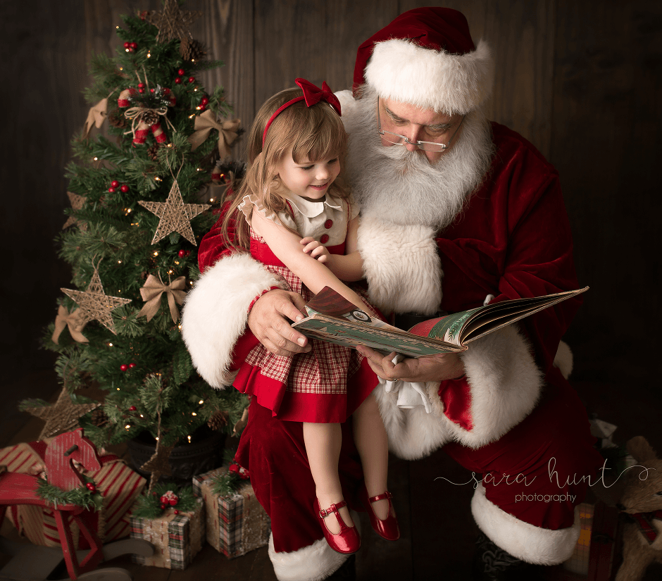 Girl and Santa reading a book — Pearland, TX — Sara Hunt Photography