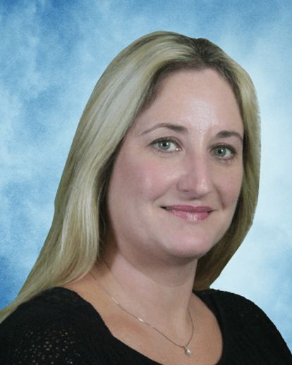 A woman with blonde hair is wearing a black shirt and a necklace