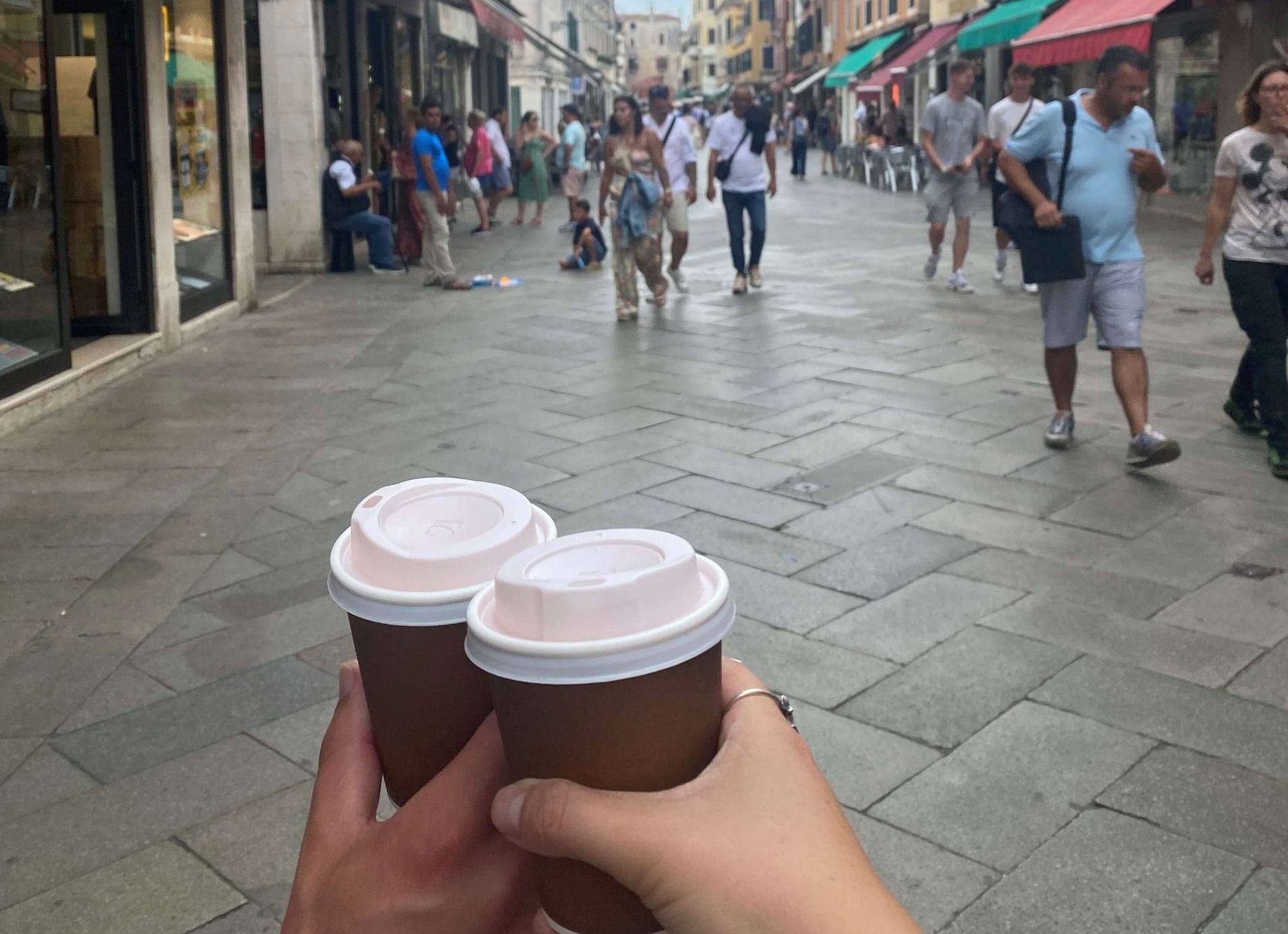 Walking down the street with coffee.