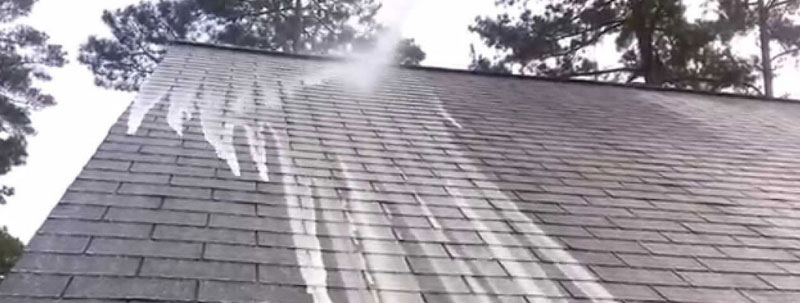 pressure cleaning roof of house