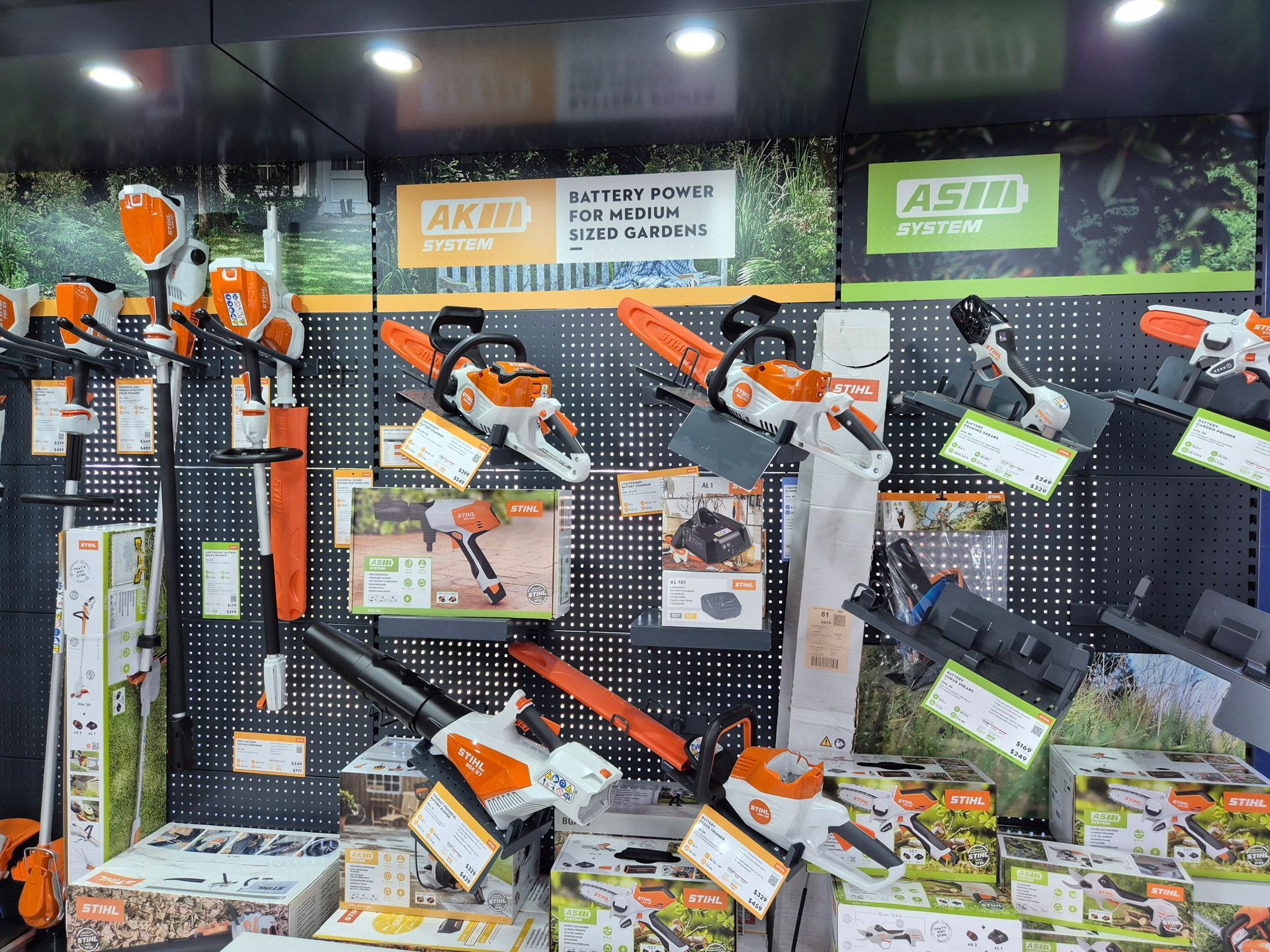A Variety of Gardening Tools Are Sitting Display in a Shop— R & M Motorcycles in Katherine, NT